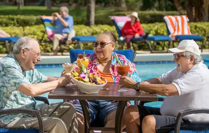 Seniors sitting poolside